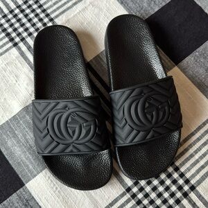 Black slides. Says Gucci, but I can’t authenticate. No box. Unisex